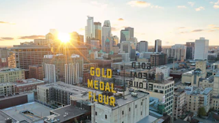The sun rises over the iconic Gold Medal Flour sign in downtown Minneapolis
